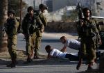 Israeli soldiers detain Palestinians during clashes at a protest  against Israeli military action in Gaza, in Silwad near&nbsp;Ramallah