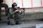 israeli-soldier-firing-rubber-bullets-at-palestinian-protestors-hebron-apr-2013
