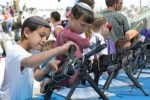 Israeli_military_shows_hardware_to_children_during_an_army_open_day_in_the_occupied_territories