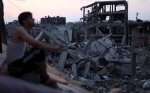 Man-overlooks-destruction-and-rubble-of-buildings-and-homes-in-gaza