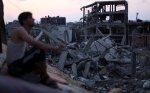 man-overlooks-destruction-and-rubble-of-buildings-and-homes-in-gaza