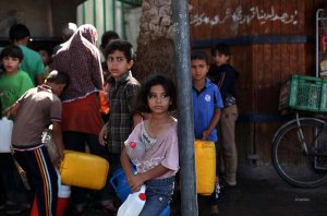 Palestinian children store water