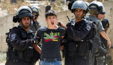 Palestinian-youth-arrested-by-Israeli-soldiers-in-Beit-Hanina