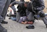Knee.neck_.IsraeliPolice.3-597×410