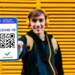1_Man-showing-covid-19-vaccination-certificate-on-mobile-phone-screen-300×300