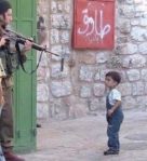 Israeli-soldier-aiming-at-child-600×659