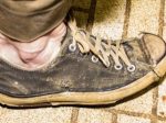 worn-out-shoes-1009421644