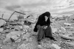 Woman_sitting_on_the_ruins_of_her_house_destroyed_by_Israel_in_Masafer_Yatta_January_2023